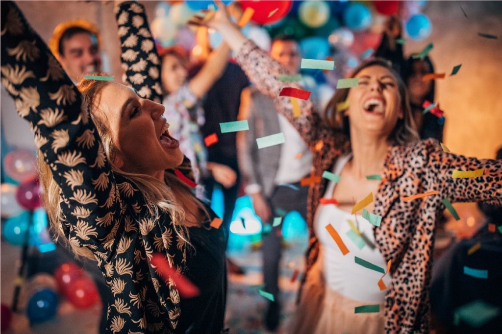 Group celebrating with confetti at event