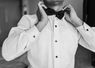 Man adjusting bow tie - tuxedo rental Las Vegas